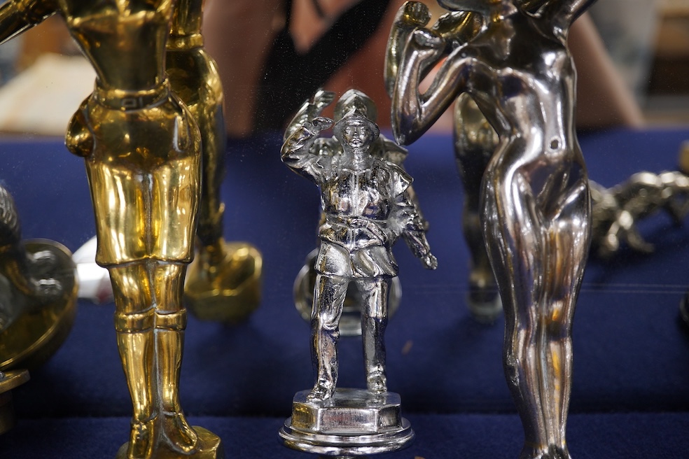Eight figural chrome and brass car mascots, etc. including a knight in full armour mounted on a threaded radiator cap, a sphinx mounted on a threaded radiator cap, plus an additional sphinx mounted on an alabaster plinth